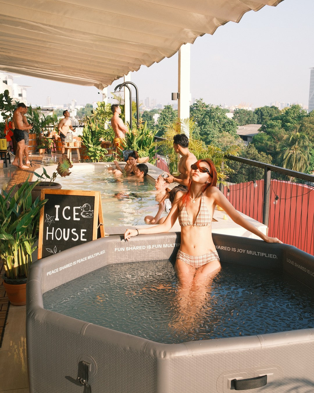 TUNDRA and ICE HOUSE rooftop cold-plunge social in Bangkok, with the skyline behind