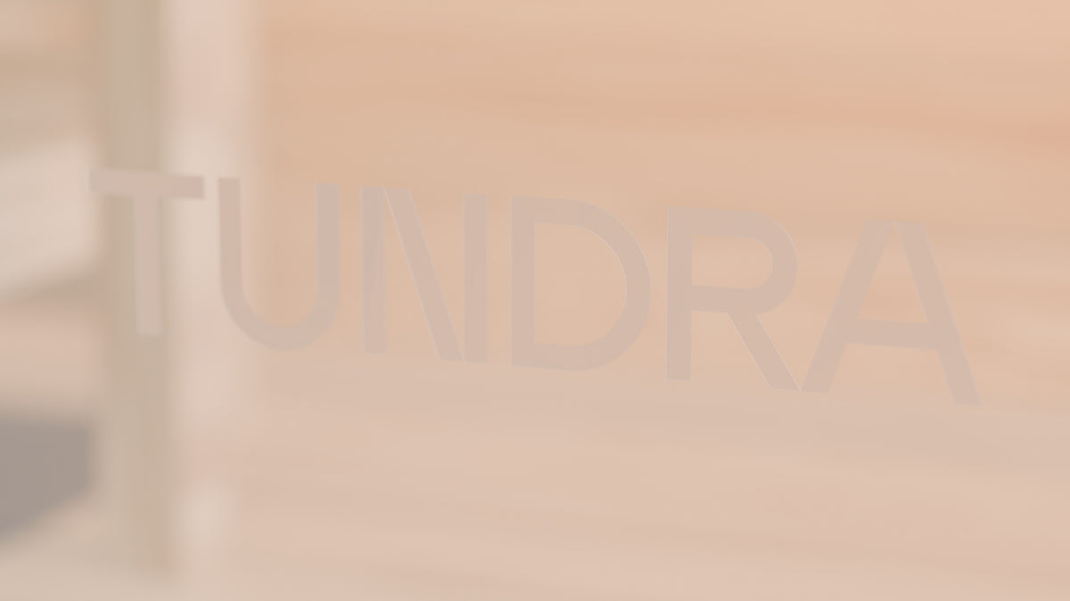 The TUNDRA wordmark sandblasted on the Ounas glass door