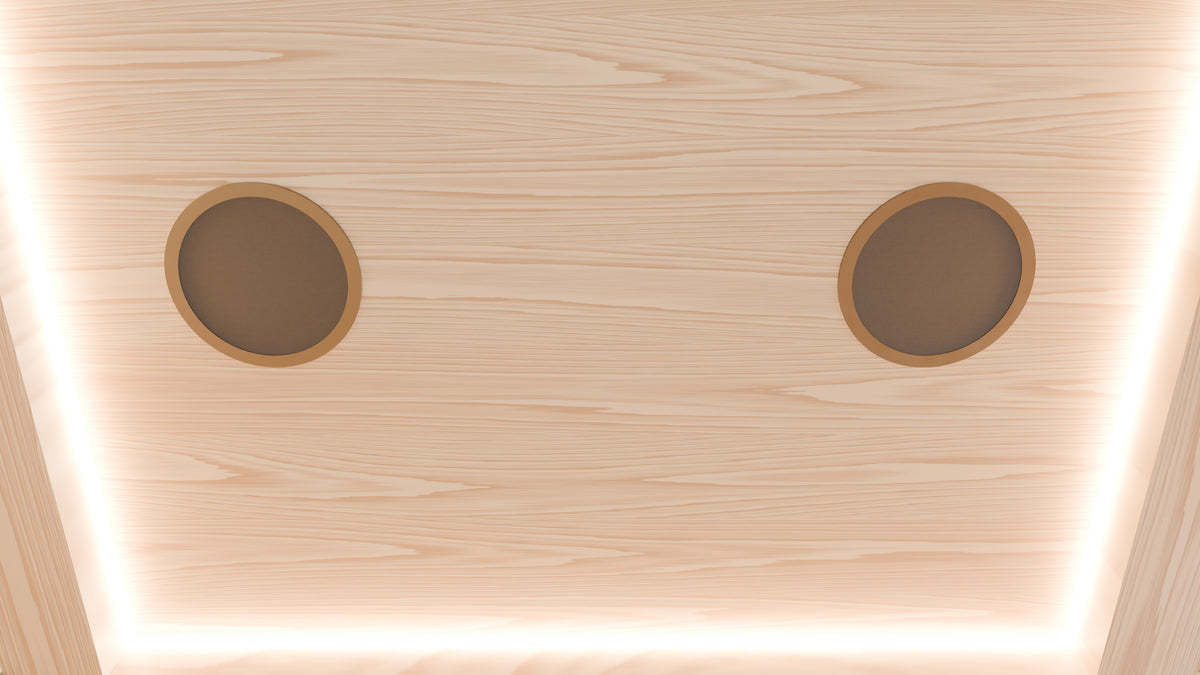 Hemlock ceiling of the TUNDRA glazed infrared sauna with amber cove light and two bronze rimmed speakers
