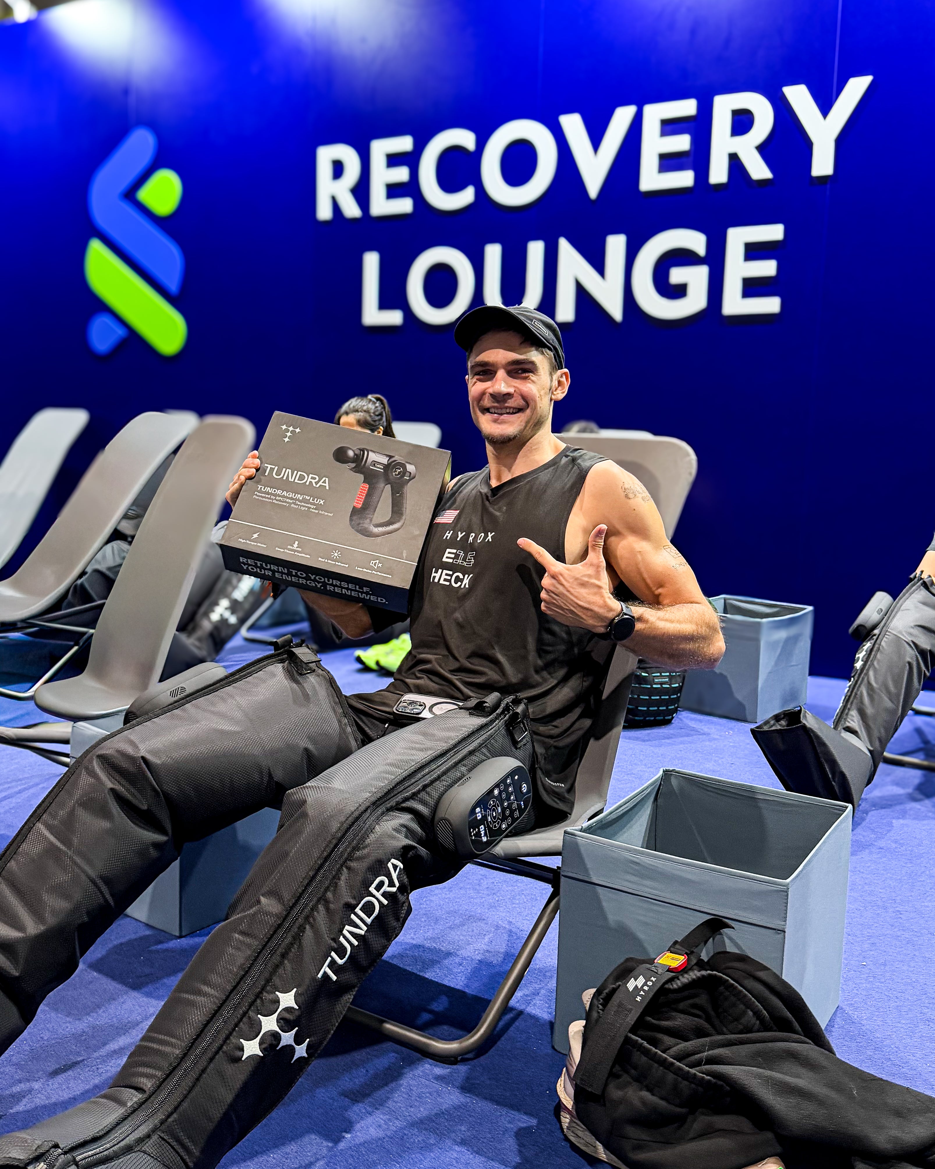 Gabe Heck at HYROX Hong Kong Recovery Lounge wearing TUNDRA compression boots