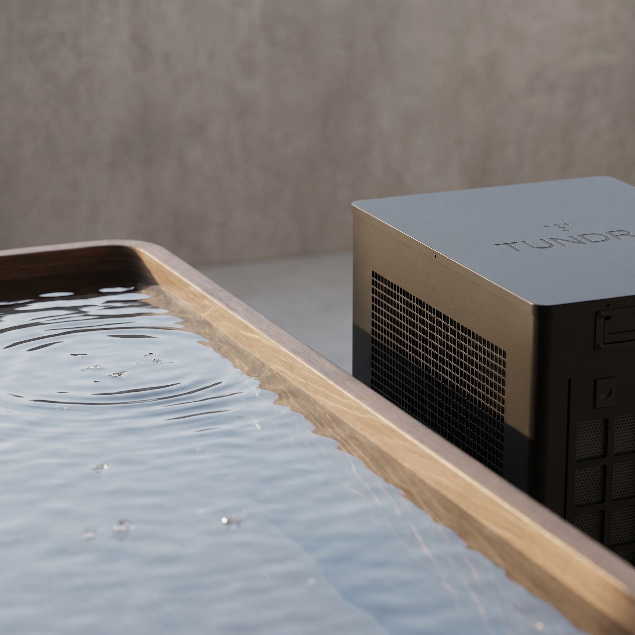 Calm ice bath water beside the TUNDRA Borealis CC chiller