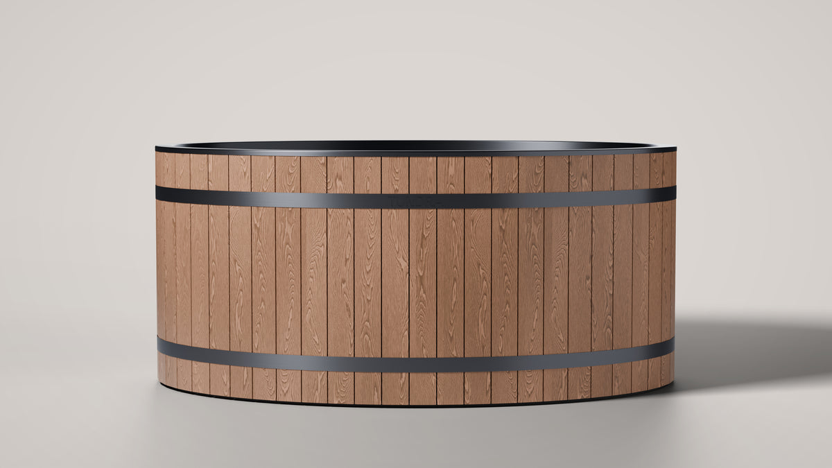 The TUNDRA Inari two person oval cold plunge, front view, WPC oak woodgrain cladding with two black bands