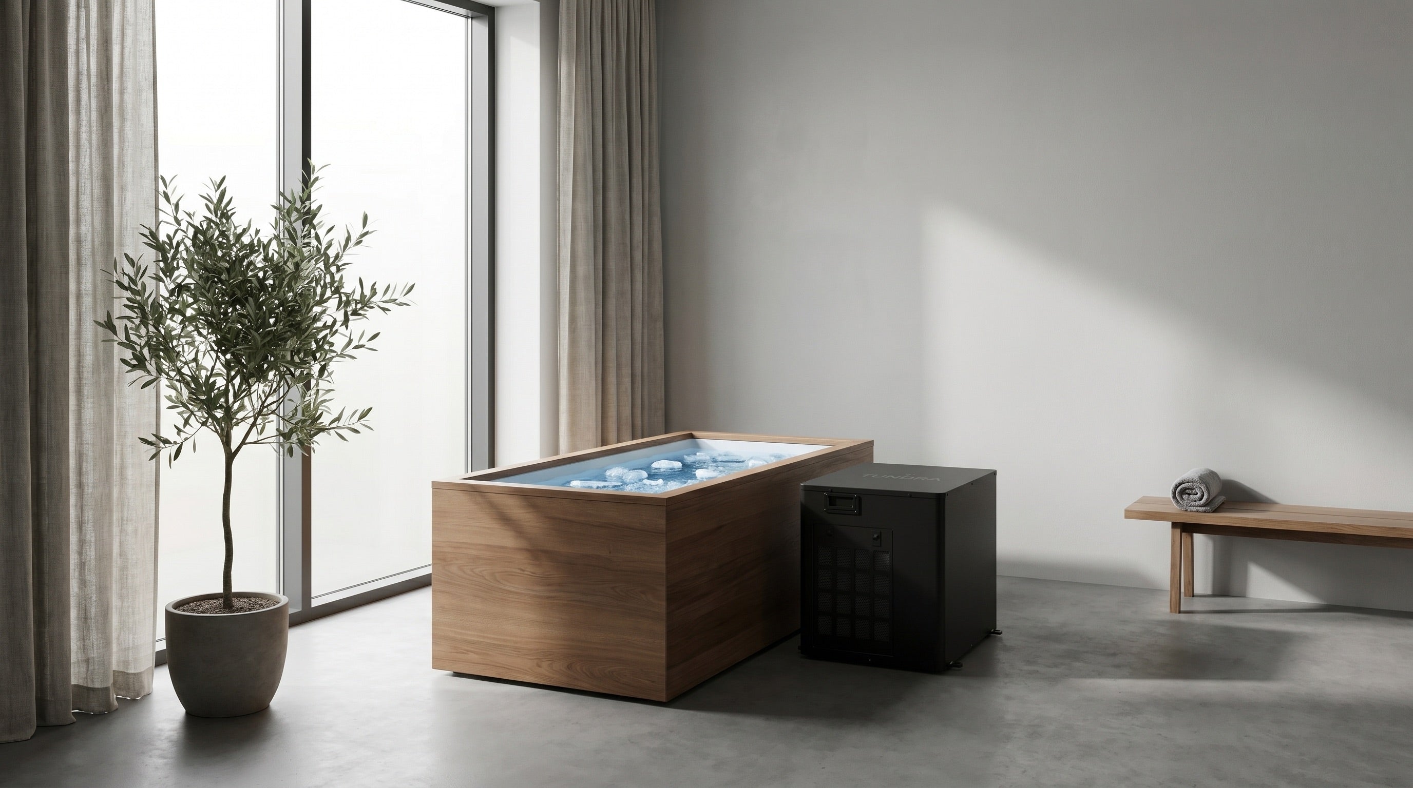 TUNDRA Borealis CC chiller beside an ice bath in a premium recovery studio