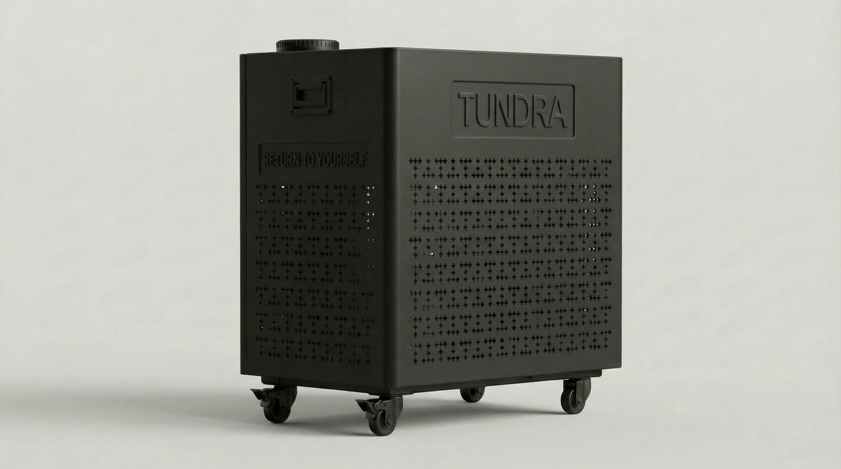 Angled side view of the TUNDRA Borealis ice bath chiller showing perforated ventilation panels, transport wheels, and compact cooling unit design